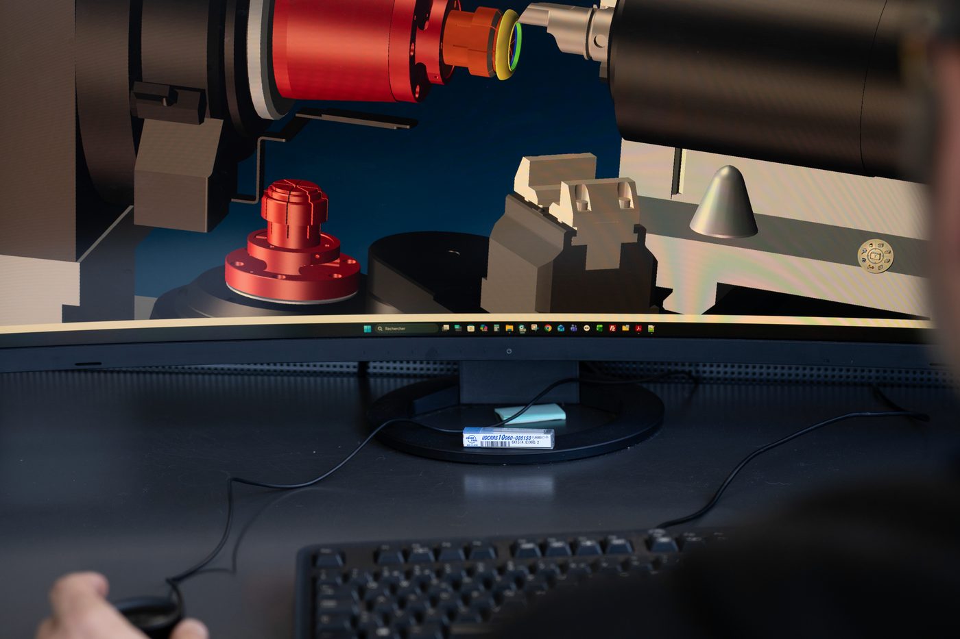 A component and its machining setup, resolved on screen.