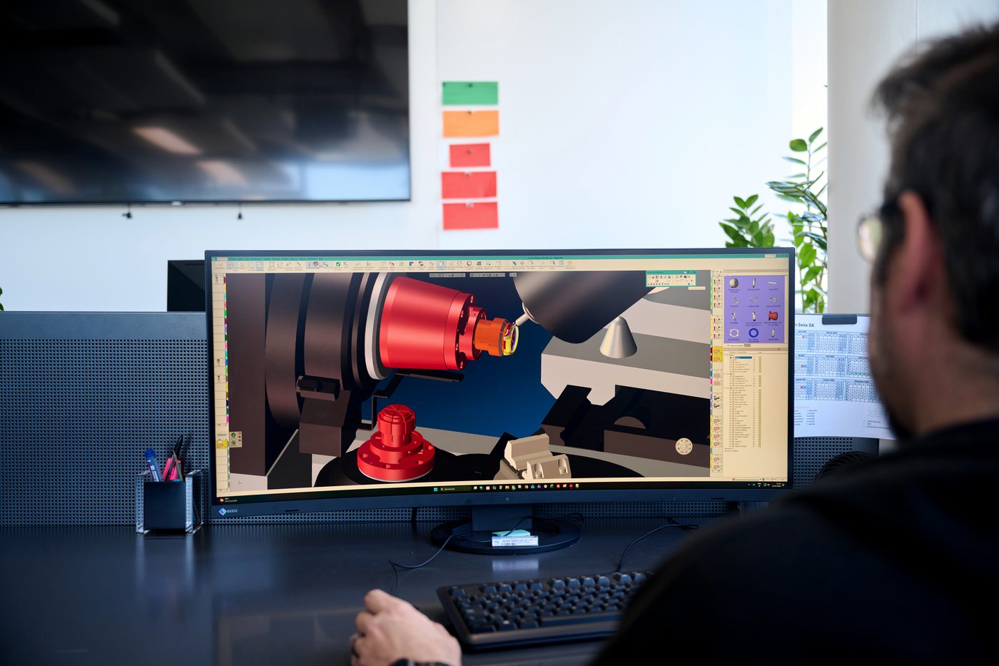 An engineer at the CAD workstation in Geneva.
